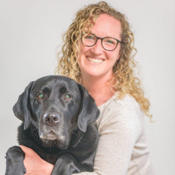 Sarah horn smiling with dog
