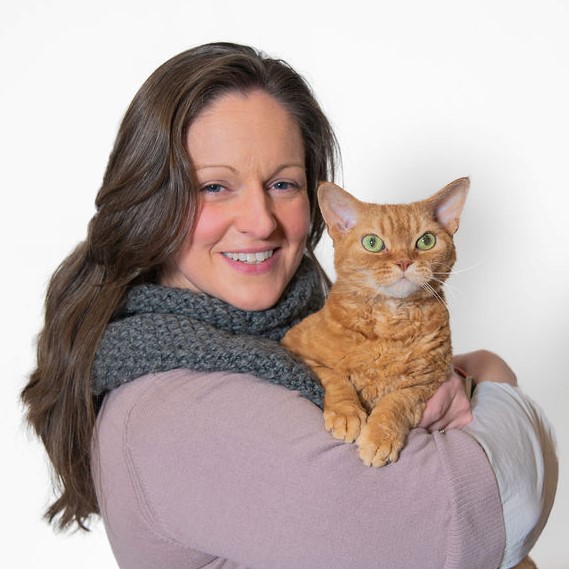 Erika Svendsen smiling and holding a cat